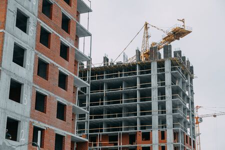 Construction of modern high-rise buildings. Phased construction of structures in winter.の写真素材