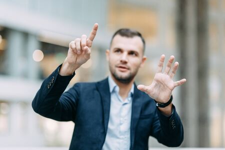 Holds and shows direction and presentation. Hand and finger of a business man in the office, profit growth.の写真素材