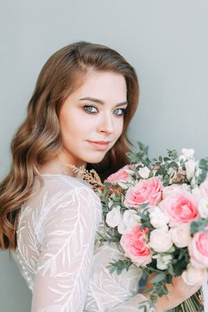 Stylish wedding in European style. Portrait of the bride in the style of fine art, white dress.の写真素材