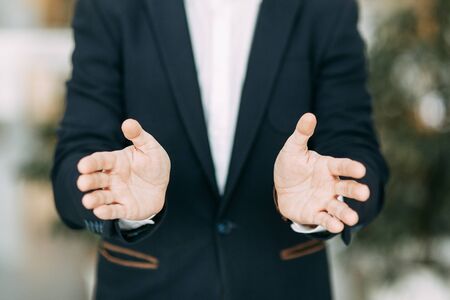 Hands of a businessman to design with a neutral photon. Okay, high five, palms and a successful man.の写真素材