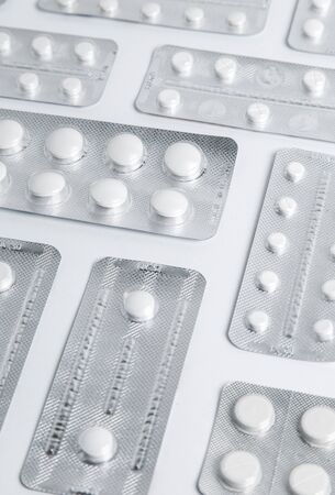 Set of blister packs of pills on white background. Pack of pills in a pile.の写真素材
