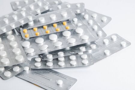Set of blister packs of pills on white background. Pack of pills in a pile.の写真素材