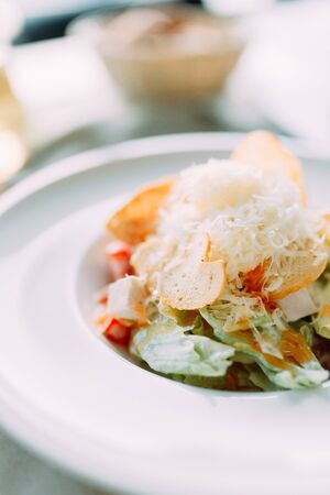 The Caesar salad and the classic shrimp. Restaurant dishes with a beautiful serving.の写真素材