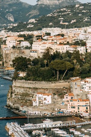 Views of the city of Sorrento in Italy, panorama and top view. Night and day, the streets and the coast. Beautiful landscape and brick roofs. Architecture and monuments of antiquity. Shops and streets with fountains and sculptures.の写真素材