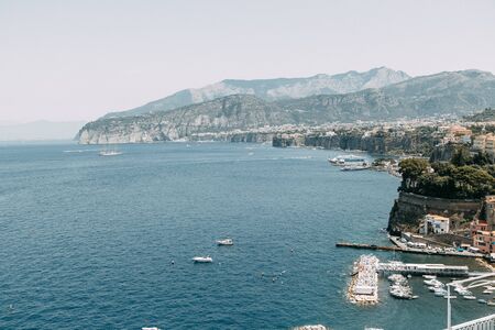 Views of the city of Sorrento in Italy, panorama and top view. Night and day, the streets and the coast. Beautiful landscape and brick roofs. Architecture and monuments of antiquity. Shops and streets with fountains and sculptures.の写真素材