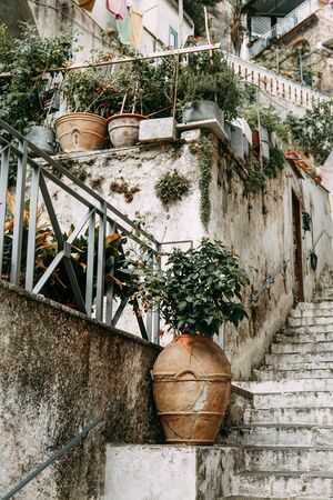 Amalfi coast in Italy, the most beautiful city. Streets and old architecture, narrow passages, shops and cafes. View from the sea and above. Panoramic view of the mountain slopesの写真素材