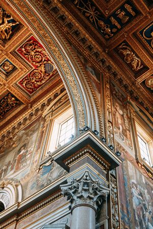 Salvatore Church in Rome, view from outside and inside. Frescoes and statues, architectural elements. A historic landmark, tourist destination. Ancient painting and stuccoの写真素材