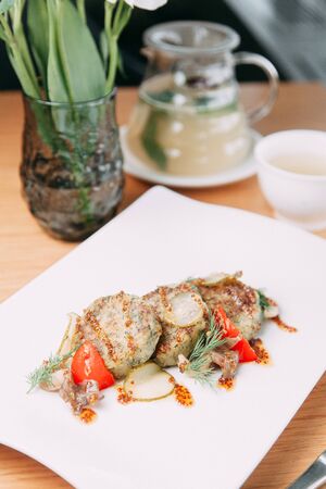 Meat cutlets with garnish on a plate. Cutlets with buckwheat and sauce.の写真素材