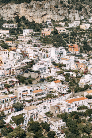The coast of Positano, Amalfi in Italy. Panorama of the evening city and the streets with shops and cafes. Houses by the sea and the beach. Ancient architecture and temples. View from a postcard on topのeditorial素材