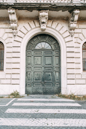 The architecture of Rome and the Italian style in stucco. Sights of the old town, tourist places. Street art, world heritage. Miracle of light. Carved columns and capitals. Ancient structureのeditorial素材