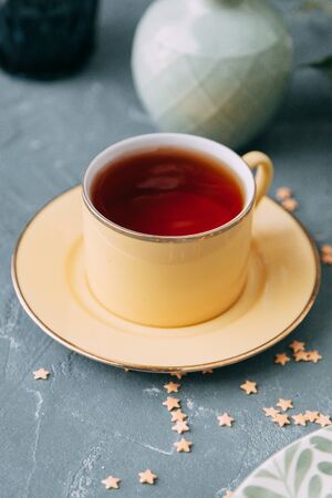 CrÃ¨me brÃ»lÃ©e with chocolate dessert with flowers. Foodstyling with tea on wooden background.の写真素材