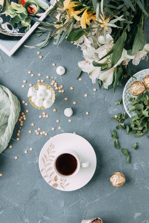 Coffee with mint on a wooden table. Food styling and desserts with flowers.の写真素材