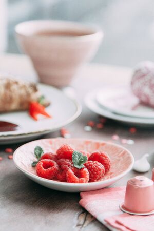 Croissants on a chic table with coffee and desserts. Food styling and layout with jam and berries.の写真素材