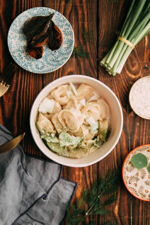 dumplings with potatoes, cheese, berries, compositions for the menu of the restaurant, decorated with greens and sauceの写真素材