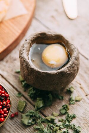 khachapuri Mingrelian with spices and herbs, on a wooden Board directly from the ovenの写真素材