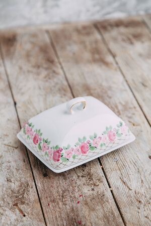 Souvenirs made of porcelain shot in the Studio with marshmallows and flowers. DIY and gift setsの写真素材