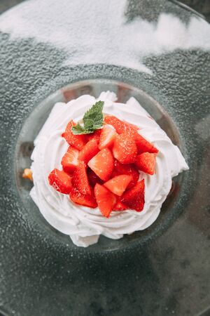 the preparation of the dessert Pavlova with strawberries and in the supply of liquid nitrogenの写真素材