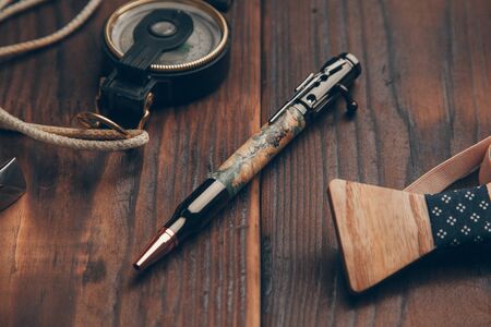 expensive pens business class for entrepreneurs, on wooden backgroundの写真素材