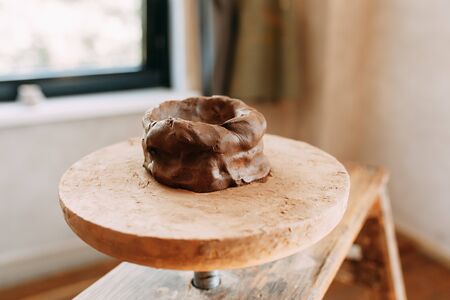 A product made of clay on a Potters wheel. Pottery store with items. Preparation of clay.の写真素材