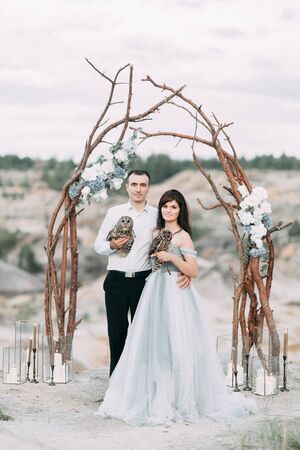 mystical wedding with owls and unusual placeの写真素材