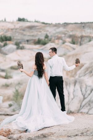 mystical wedding with owls and unusual placeの写真素材