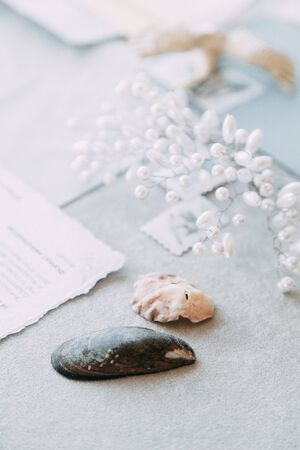 Stylish printing at the wedding ceremony, beautiful details and decor with flowers and rings. Wedding invitations made by hand with calligraphyの写真素材