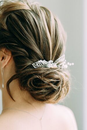 Beautiful bride in a white Studio. Russian wedding in St. Petersburg. Portrait and details in fine art style.の写真素材