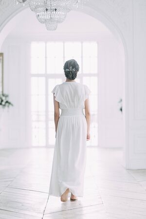 Sunny morning of the bride. Boudoir photo shoot in the Studio. Wedding in Russia in the style of fine art.の写真素材