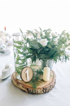 Decor wedding table in the cafe. Floristry and glass glasses at the wedding.の写真素材
