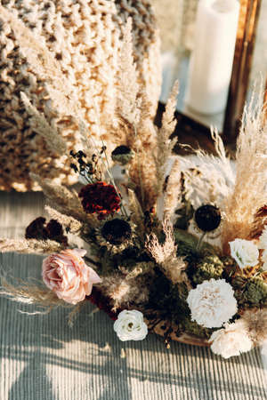 Wedding decor from dried flowers in boho style. Wedding in European style fine art at sunset.の写真素材