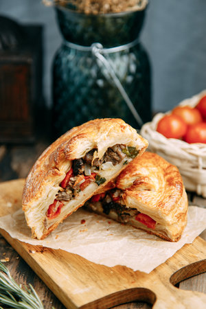 Steak pie with meat and vegetables. Puff pastry pie national cuisine.の写真素材