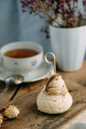 Round cake with mousse cream on a wooden table. Custard cake with chocolate and berry filling.の写真素材