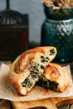 Swirling round pie close - up in the cut. Traditional Moldovan and Romanian cake in the shape of a snail.の写真素材