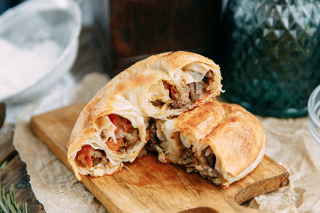 Swirling round pie close - up in the cut. Traditional Moldovan and Romanian cake in the shape of a...
