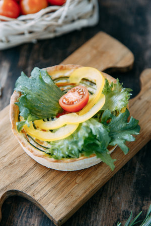 Tartlet made of yeast-free dough close-up. Hot appetizer with mushrooms, chicken and herbs.の写真素材