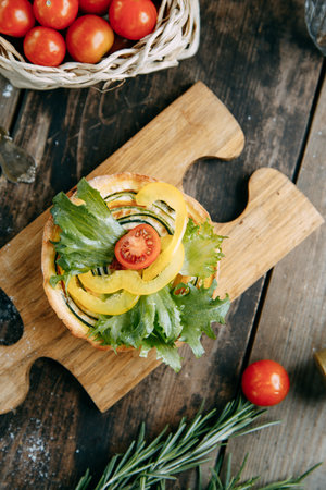 Tartlet made of yeast-free dough close-up. Hot appetizer with mushrooms, chicken and herbs.の写真素材