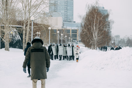 Yekaterinburg, Russia - january 23, 2021: People protesting against Putin in the square. Action in support of Navalny in winter.のeditorial素材