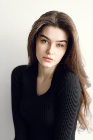 vogue style portrait of a beautiful gentle woman on a white background. Beauty portrait, tests in a bright studio.の写真素材