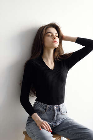 vogue style portrait of a beautiful gentle woman on a white background. Beauty portrait, tests in a bright studio.の写真素材
