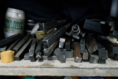 Old lathe cutters in stock. The operation of a lathe cutting brass material parts by cutting.