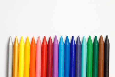 Children's school crayons on a white background. A set of colorful crayons in the form of a rainbow.の写真素材