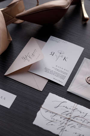 Wedding invitation, fashionable black background with shoes. A set of dark wedding prints on a...