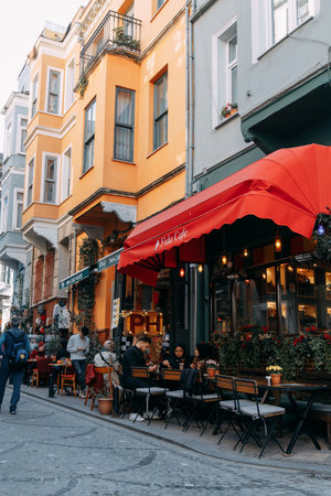 ISTANBUL, TURKEY - NOVEMBER 13: Bright buildings. Street cafes with people, historical view of the city.のeditorial素材