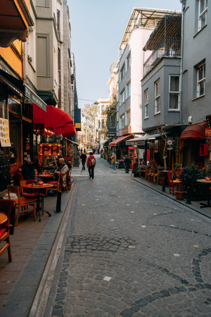 ISTANBUL, TURKEY - NOVEMBER 13: Bright buildings. Street cafes with people, historical view of the city.のeditorial素材