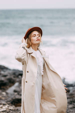 Black Sea coast, Turkey. A beautiful woman walks along a rocky shore.の写真素材