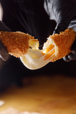 Delicious street food to take away. Homemade corn dogs with French fries, ketchup and mustard.の写真素材