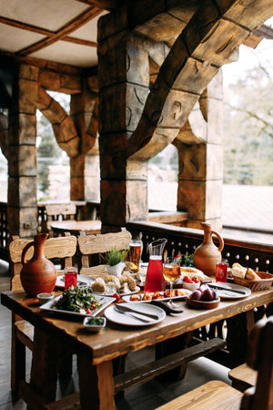 Georgian cuisine, a large set table with various dishes for the whole family. Shish kebab, Lula,...