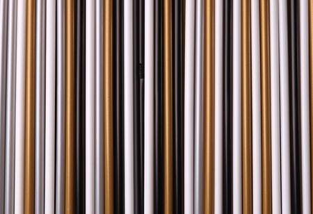 A set of straws of multicolored plastic tubes of unusual colors for the background