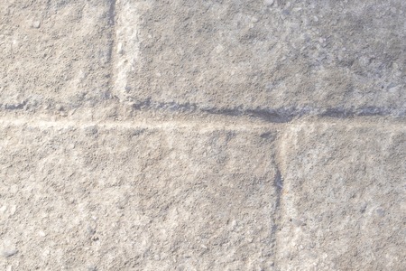 The road is paved with gray sets with solar modulations. Road surface.の写真素材