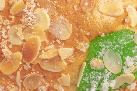 Spanish typical Epiphany cake Roscon de Reyes with fruit, backgroundの写真素材